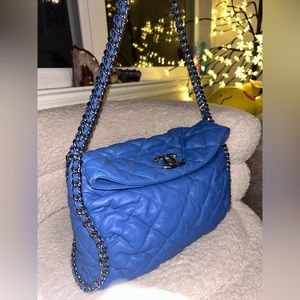 Chanel chain around large messenger bag